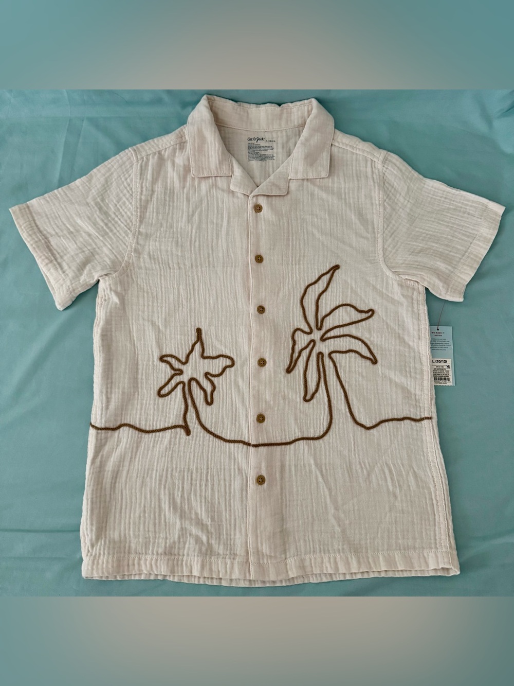 Boys' Short Sleeve Woven Button-Down
Shirt - Cat & Jack Cream L
